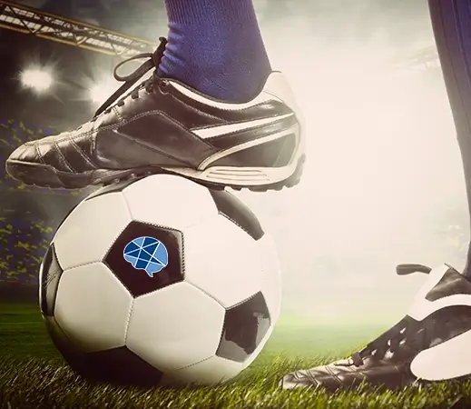 A close-up of a soccer ball with a foot resting on top not only highlights professional sports but also emphasizes BTC's specialization in mental health treatment for athletes